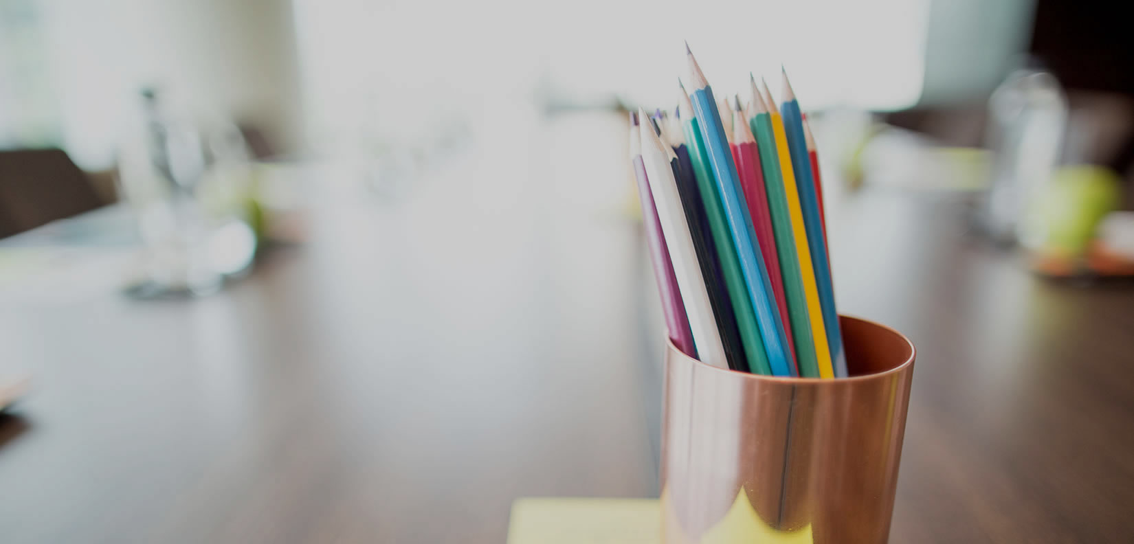 colored pencils in a cup