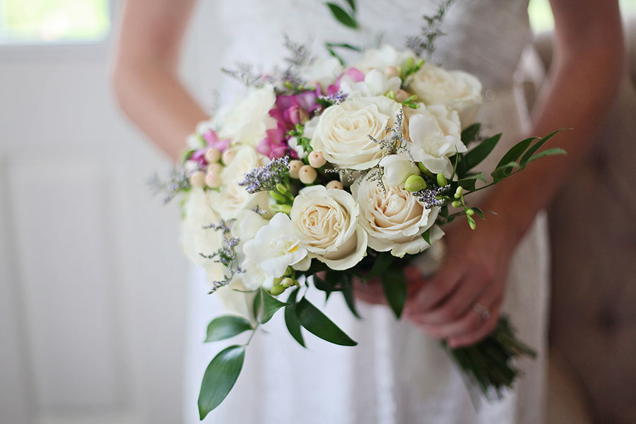 bride with white roses