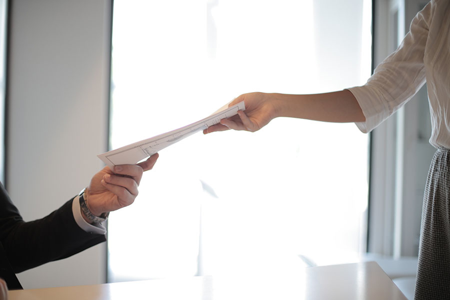 handing over papers