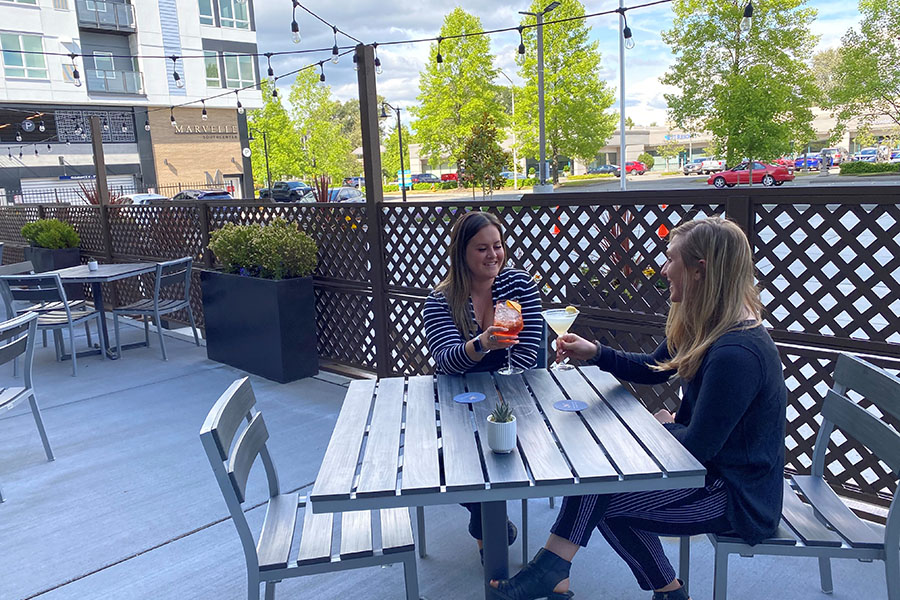 2 people eating outdoors